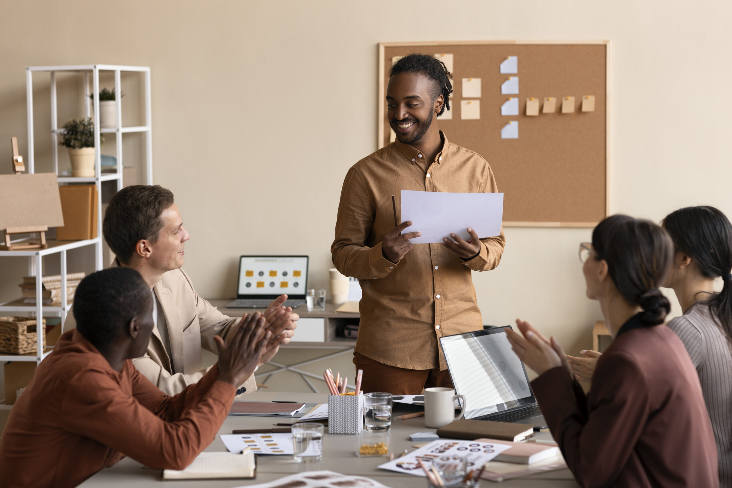 medium shot people working office