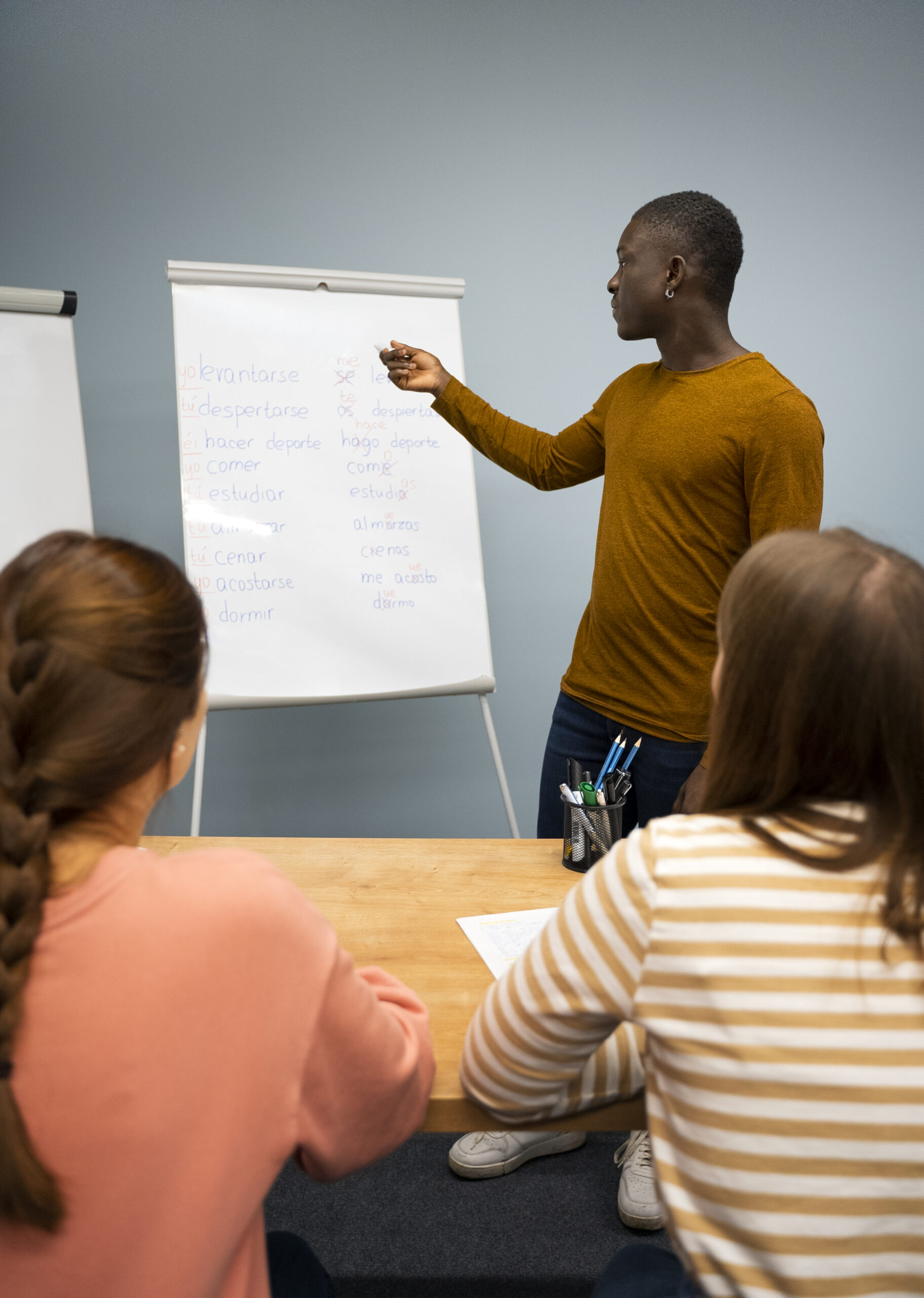 side view man explaining grammar mistakes