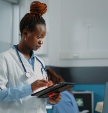medic looking at tablet screen for healthcare system